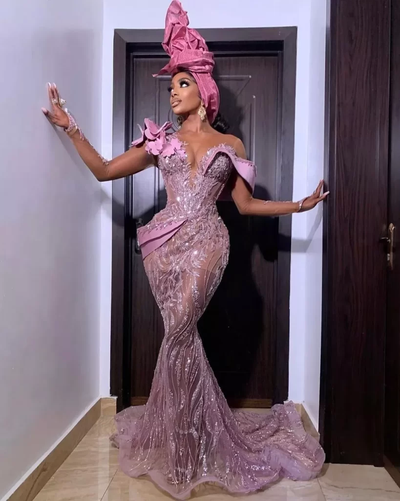 Purple Off Shoulder Sequence Material Gown Styles in Nigeria