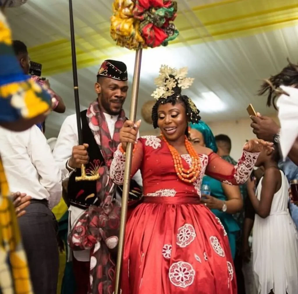 Beautiful Calabar Bride In Red Efik Onyonyo Dress, Wig Comb and Matching Staff