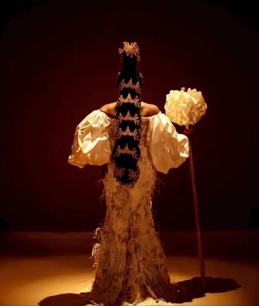 Efik Bride In Gold Off Shoulder Onyonyo Dress, Wig Combs, Jewelry and Decorated Staff
