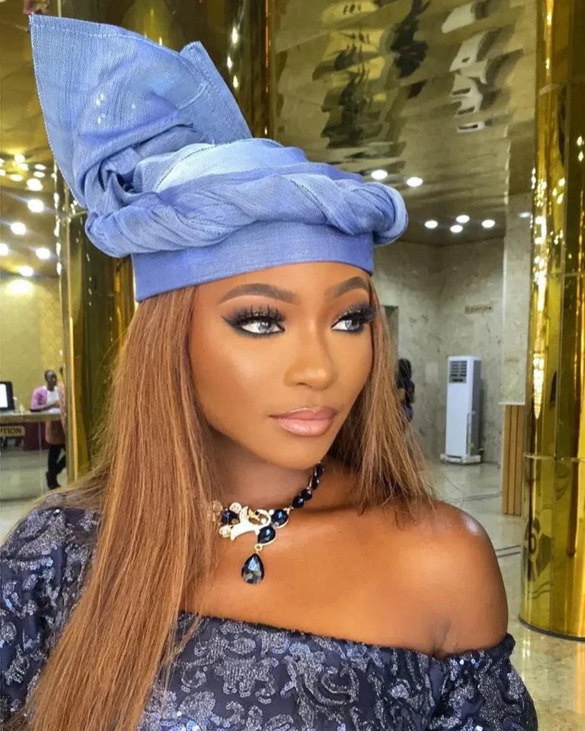 Women in Nigeria wear gele hairstyles to wedding