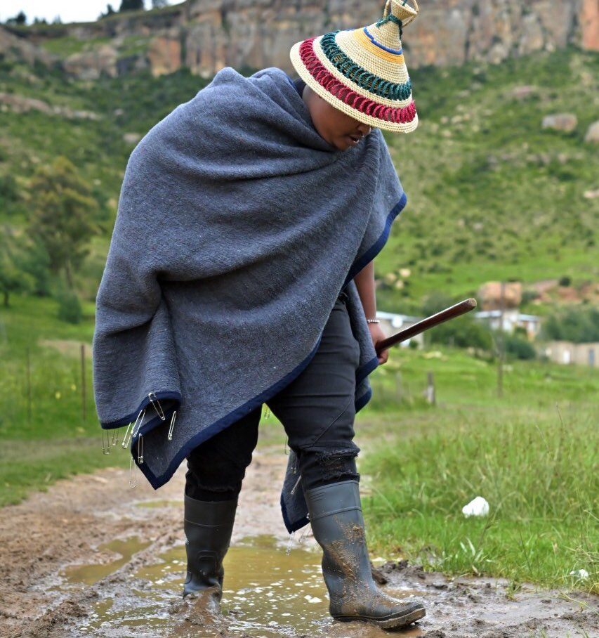 Sotho groom in Shweshwe inspired shirt, Basotho blanket and straw kobo hat