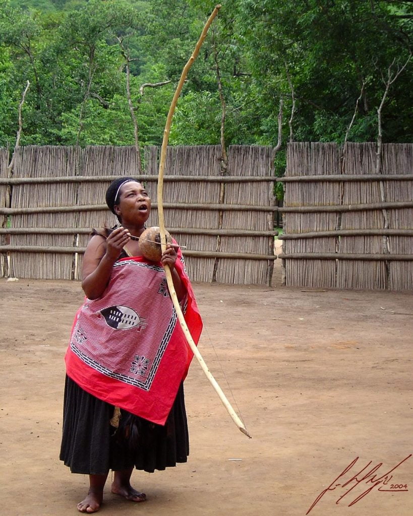 Traditional Swaziland women singing and dancing with traditional attire