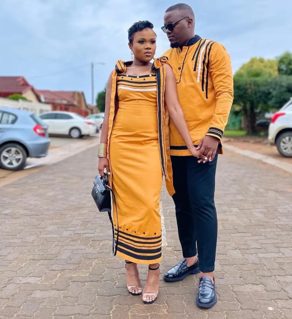 Couple In Beautiful Orange and Black Xhosa Umbhaco Traditional Attire