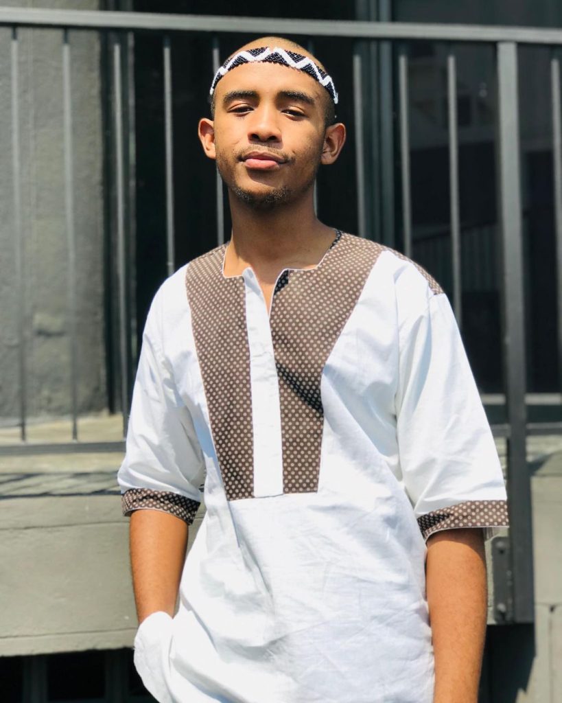 Man In Xhosa Traditional Pants and Shoulder Cloth With Black T-shirt 