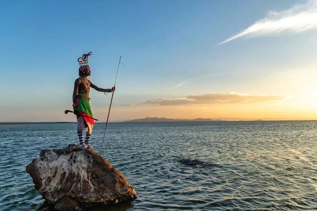 Young moran warrior standing by Lake Turkana