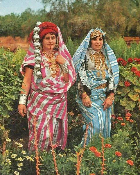 white shirt 'Jalabiya'or 'Qamis', long trousers 'Sirwal' and a vest called 'Sadriya'