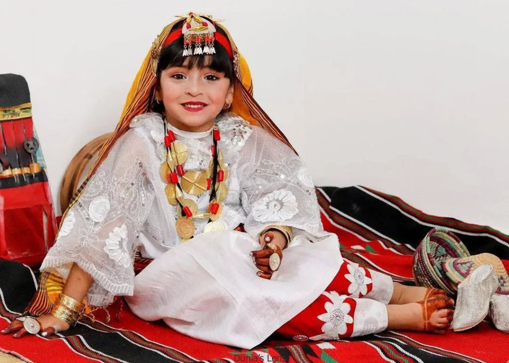 Kids wearing traditional wedding dress during Janzour Spring and Peace Festival