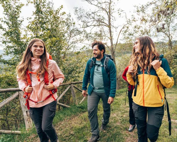 friends on the weekend doing a trekking in basic hiking outfits