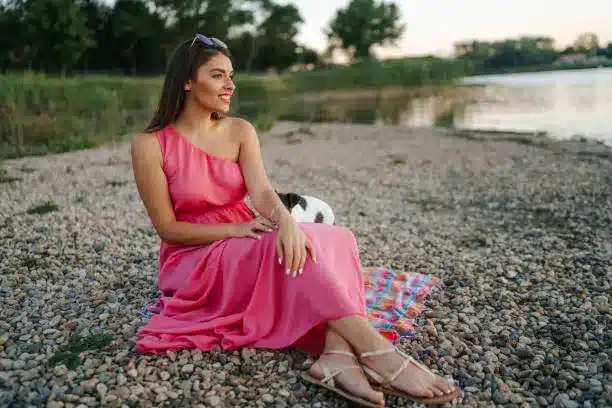 Pink one-shoulder midi dress and thong sandals
