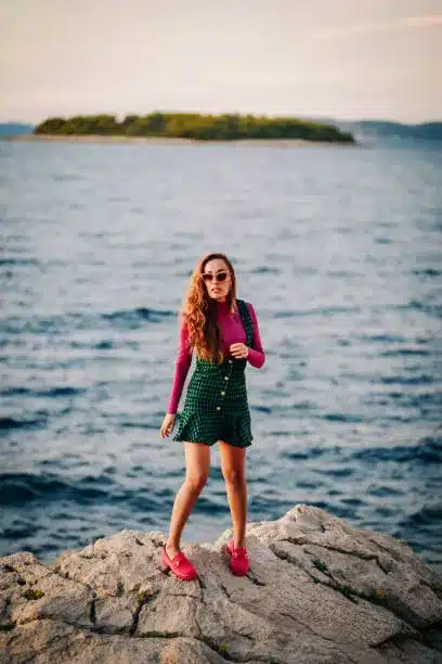 Pink turtleneck top and fuchsia chelsea boots