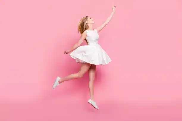 Baby pink flare dress with white lace up sneakers